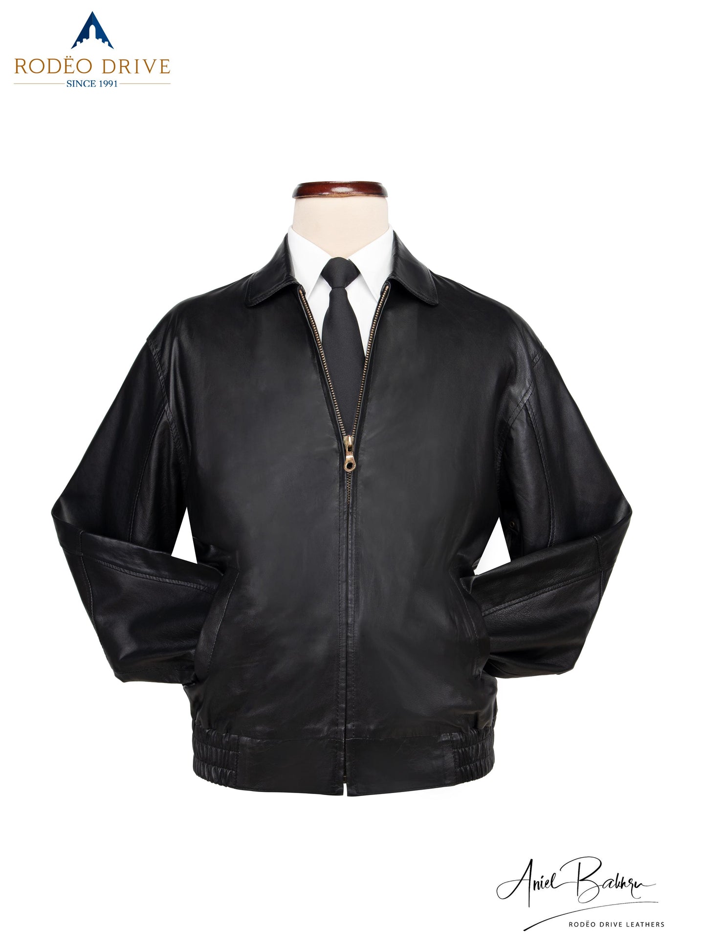 image of Bomber jacket displayed on mannequin. a white shirt and neck tie tucked inside,