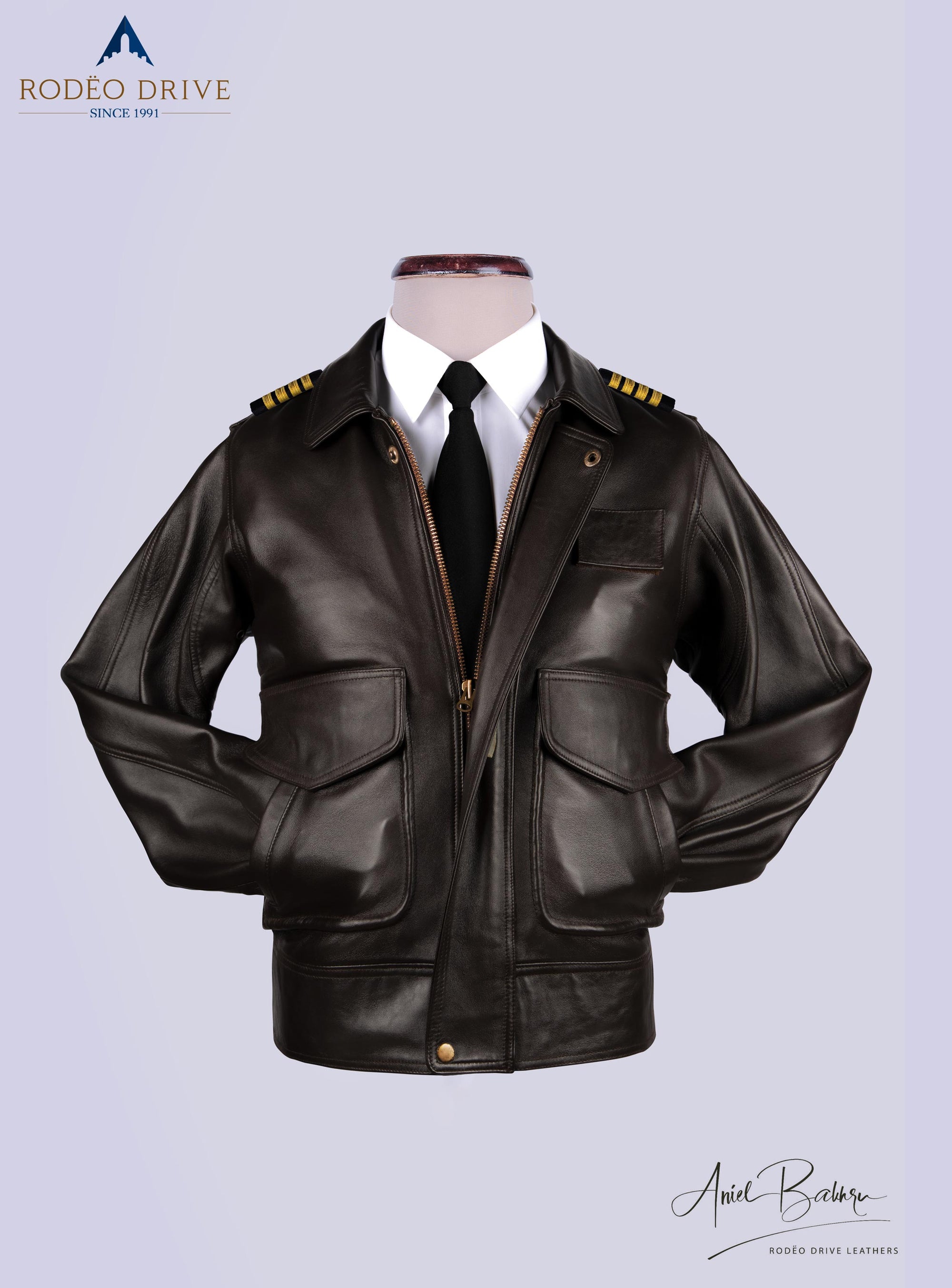 Front image of UPS BROWN UNIFORM LEATHER JACKET for WOMEN . It is displayed on mannequin. half zipped. a white shirt and a neck tie is tucked inside jacket. both hands of jacket are pushed inside slit pockets.
