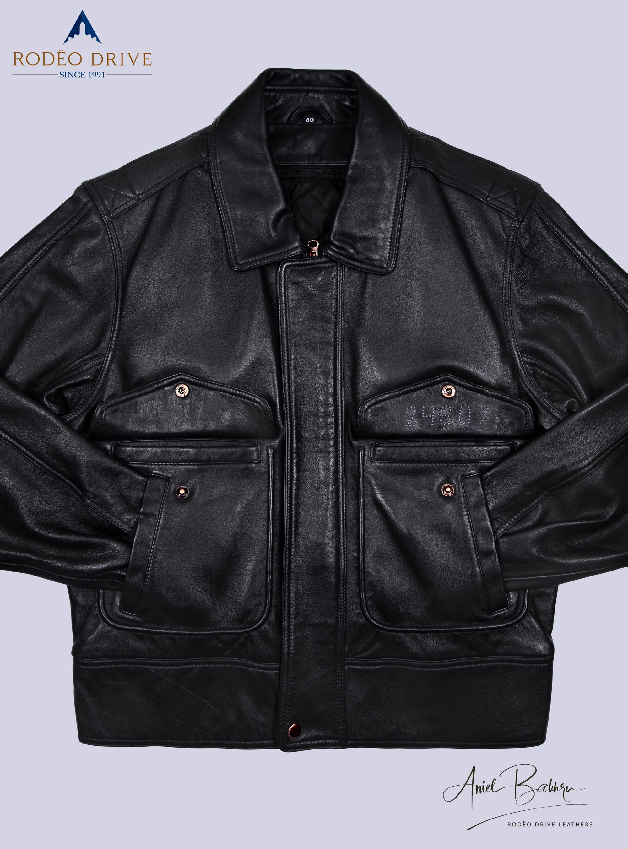 Front complete image of black BOMBER JACKET . The hands of jacket are tucked inside slit pockets. remaining two  pockets are buttoned