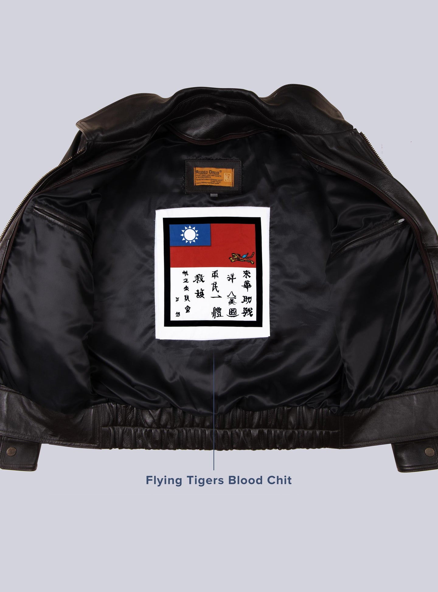 Inside image of BROWN UNIFORM LEATHER JACKET for MEN. a flying tigers Blood chit is sewed inside.
