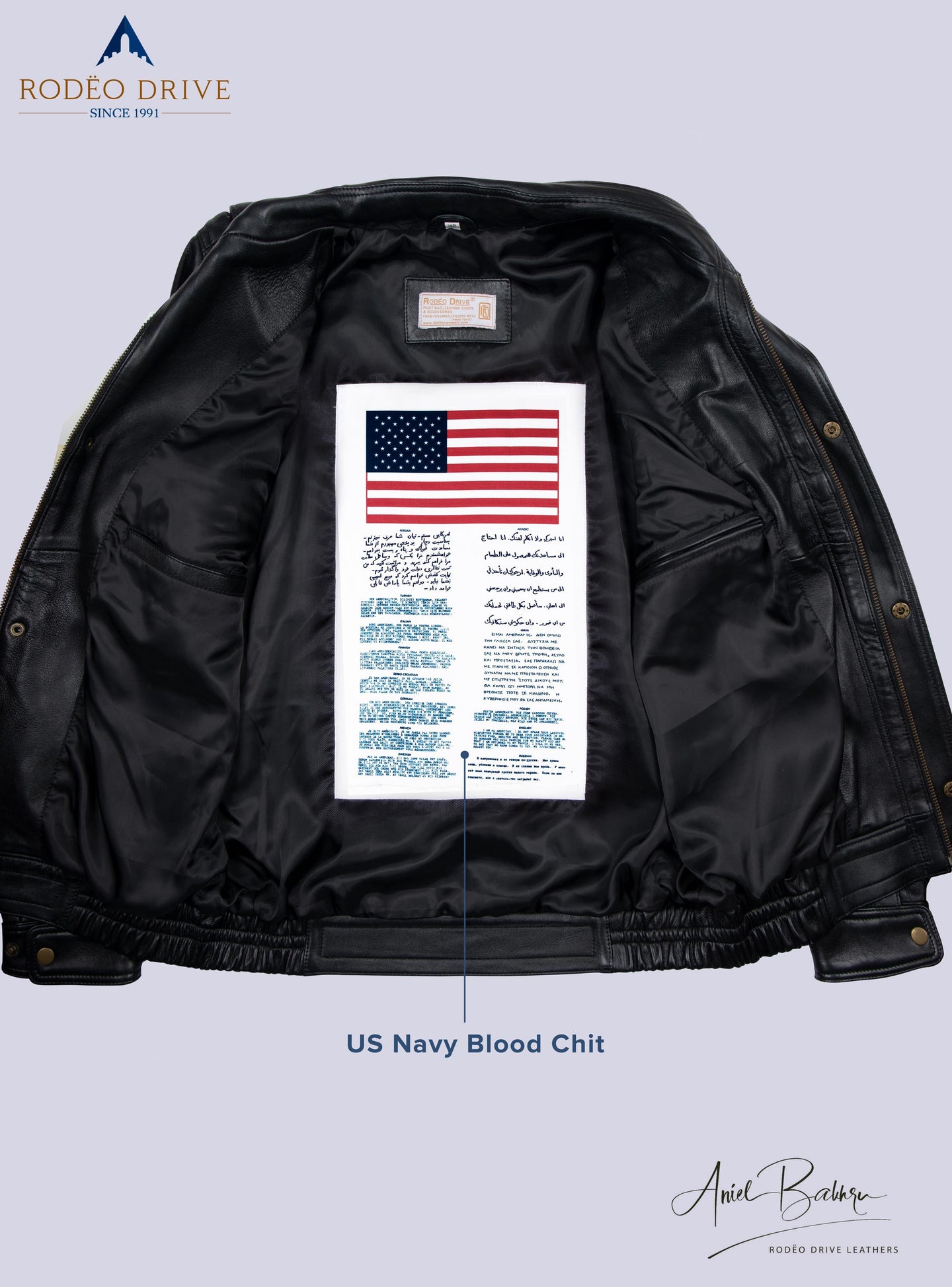 Image of inside part of Bomber short jacket, A USA Navy Blood chit is sewed inside.