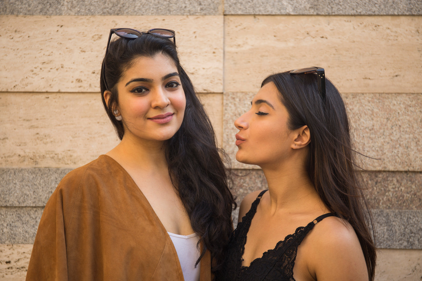 Female models wearing Bomcrewmall poncho