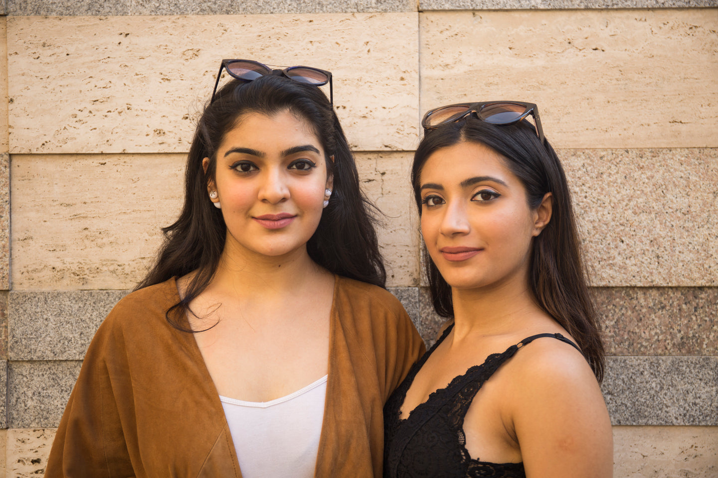 Female models posing wearing bomcrewmall leather poncho
