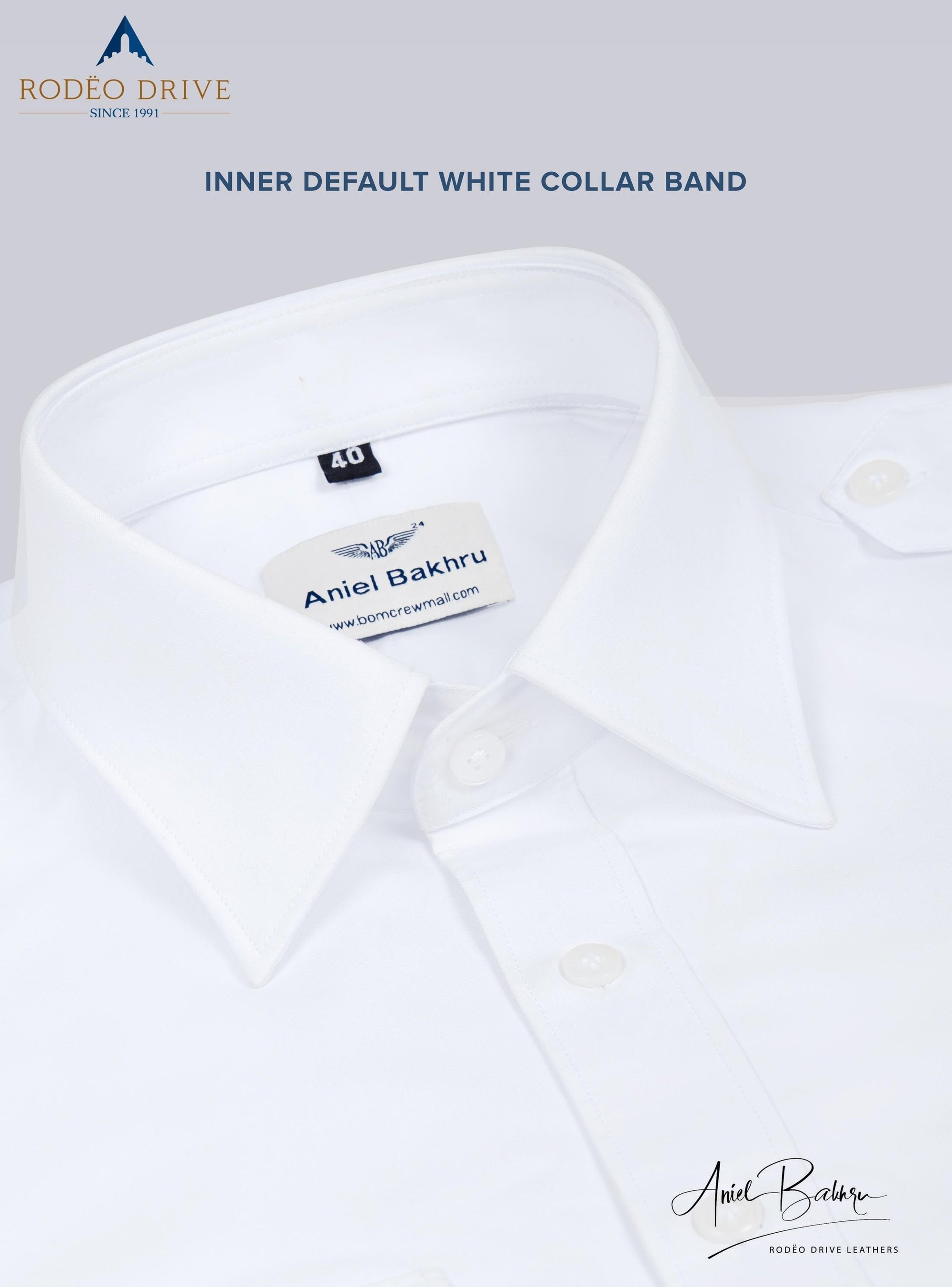 A close view of White Standard Women's Pilot shirt. It is neatly folded. It i buttoned. It depicts inner default white collar band