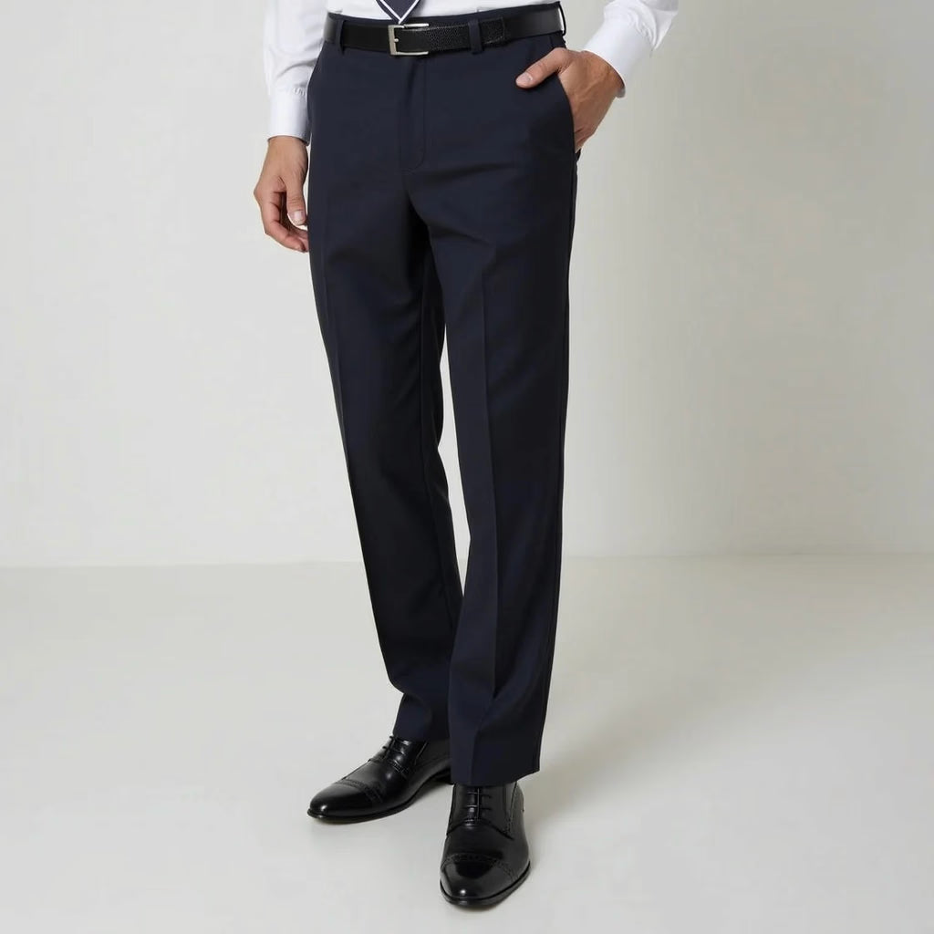A person wearing dark navy pilot uniform pants with a black belt, a white dress shirt, and black dress shoes, shown from the waist down against a plain light studio background.