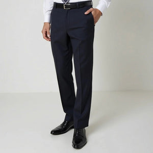 A person wearing dark navy pilot uniform pants with a black belt, a white dress shirt, and black dress shoes, shown from the waist down against a plain light studio background.