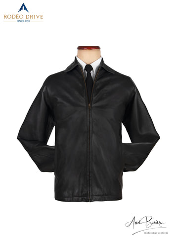 Front image of Black leather jacket. It is displayed on mannequin. It is zipped. A white shirt and neck tie is tucked in. A classic way to wear the jacket