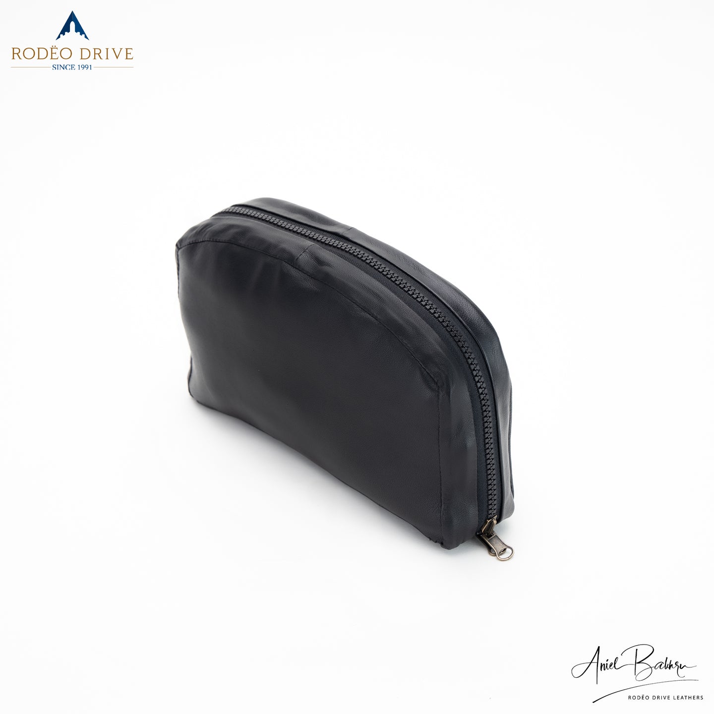 Side view of black COLLAPSIBLE LEATHER BACKPACK. 360 angle zipped.