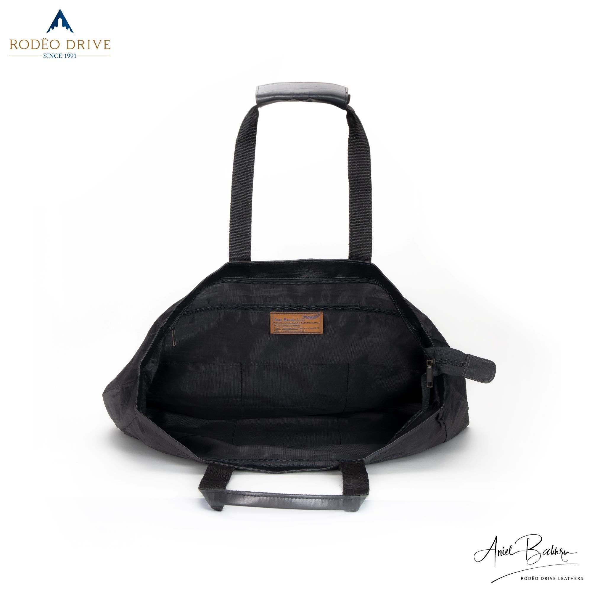 Open inside image of black KELLY LEATHER CORDURA SHOPPING BAG. It is spacious.
