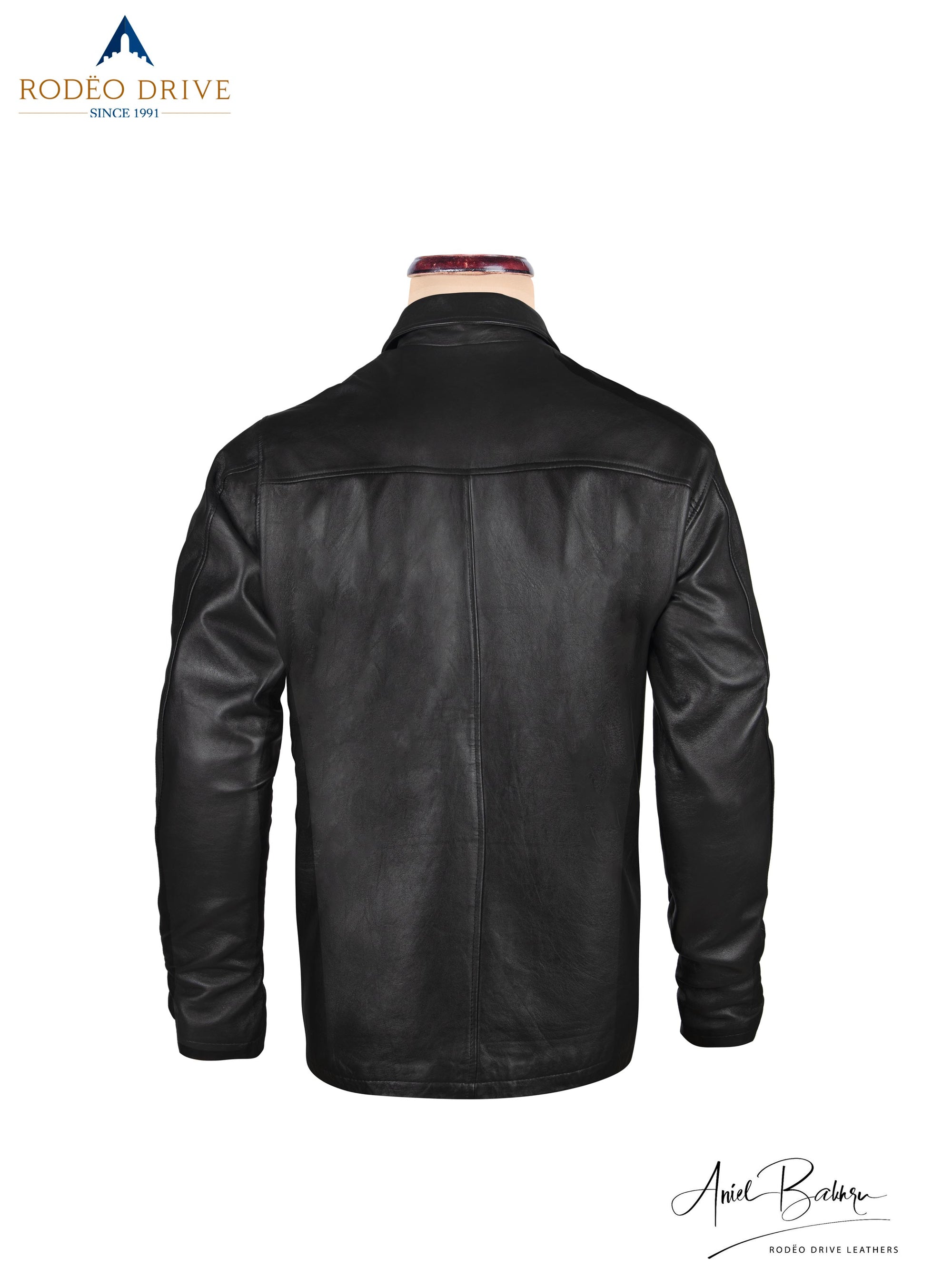Back side image of black leather jacket. Displayed on mannequin.