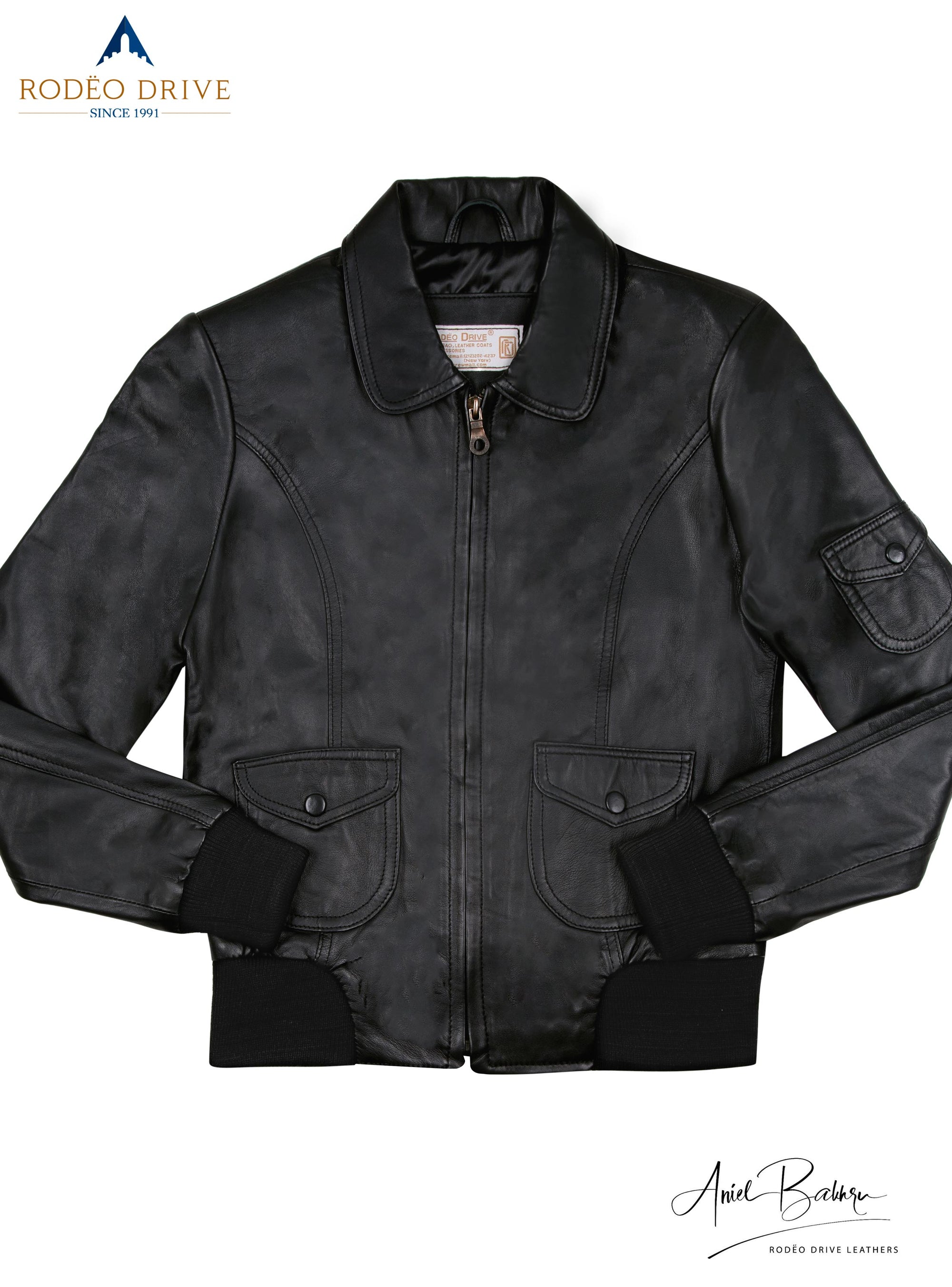Image of long handed black TRENCH COAT.  Full hand coat. hands are tucked inside slit pocket.