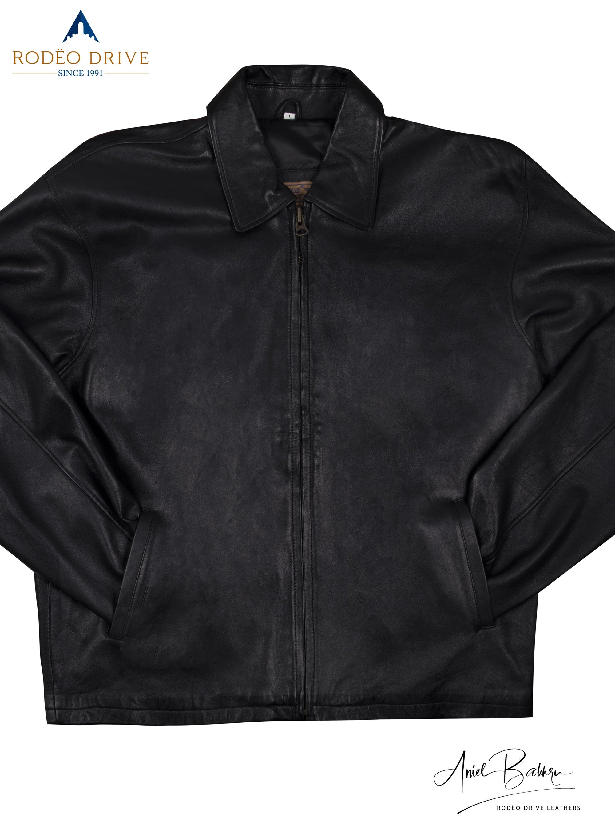 Close entire image of black leather jacket image. hands of it are tucked in side slit pockets