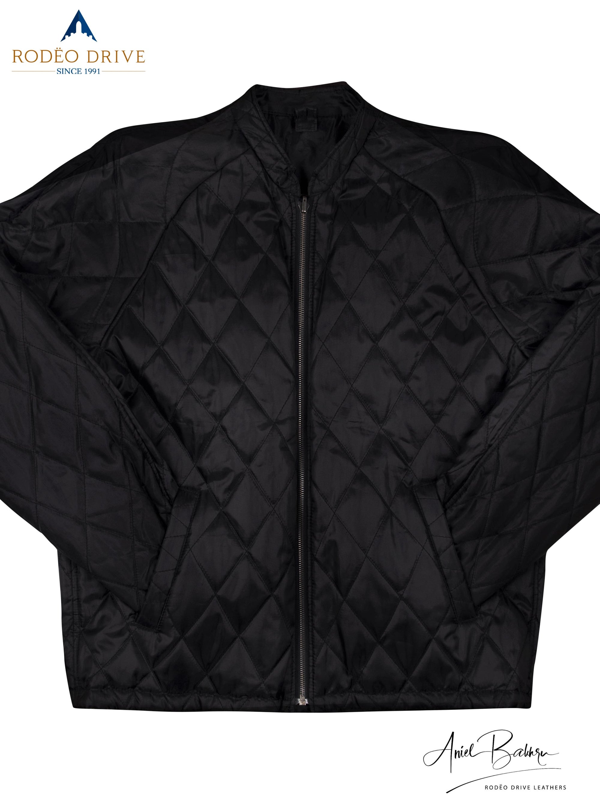 Full image of patterned black leather jacket. Both its hands are tucked inside side slit pocket.