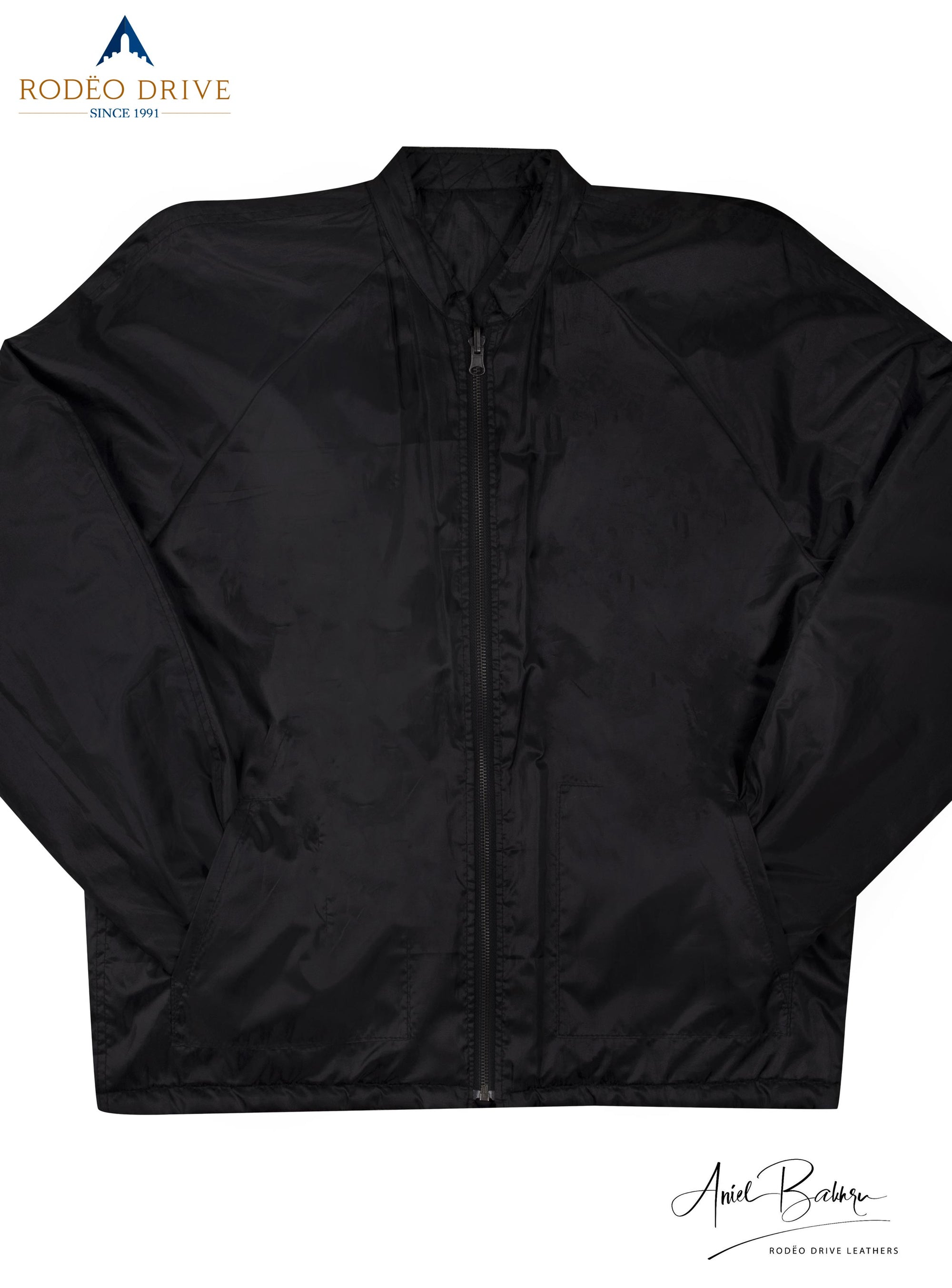 Front image of full black jacket. it is zipped. Its hands are tucked in side slit pockets