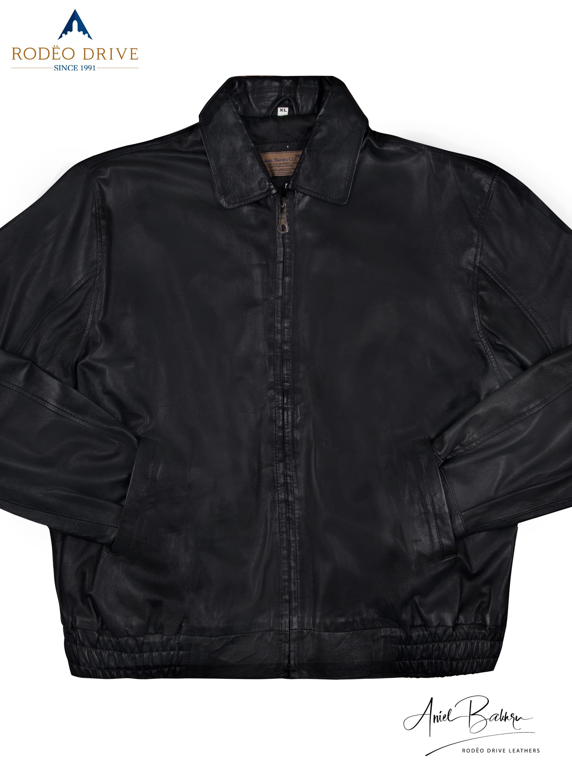 Close full view of Bomber jacket. It is black in color, zipped and its hands are tucked in slit pocket.