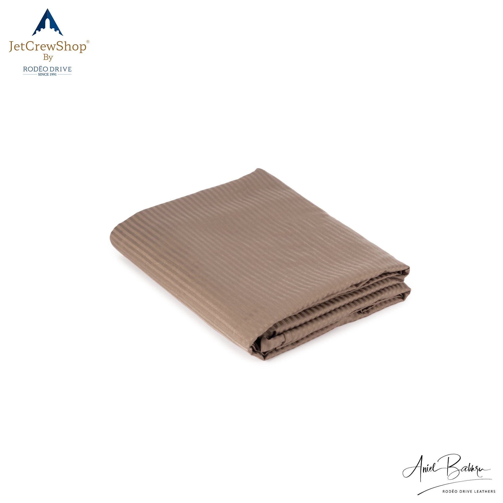 Image of folded sleeping sack. It is light colored