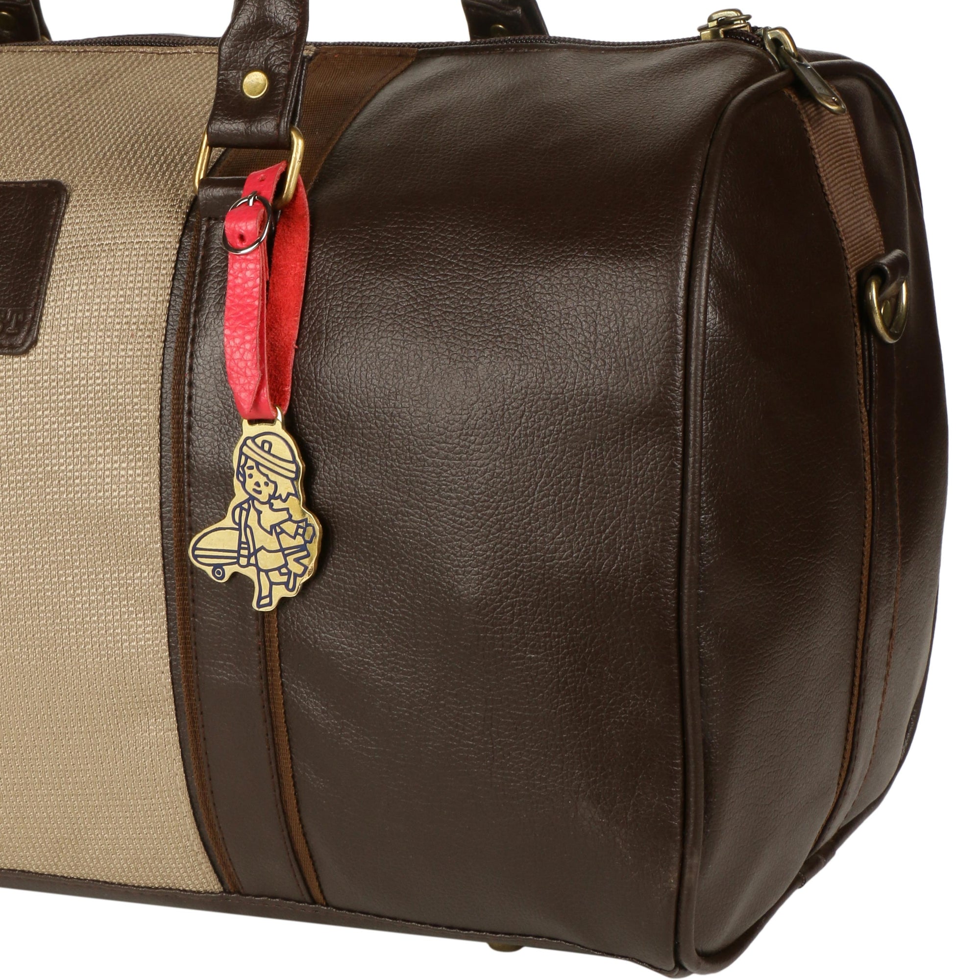 Cute Flight Attendant Brass Tag with red latch being used on a duffel bag.