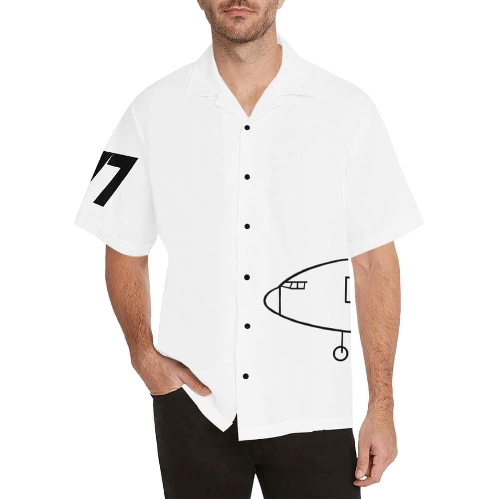 Image depicts a man wearing white shirt with black buttons