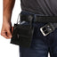 Image of ROME GYPSY PROOF WALLET tucked on belt of model. stylish usage.