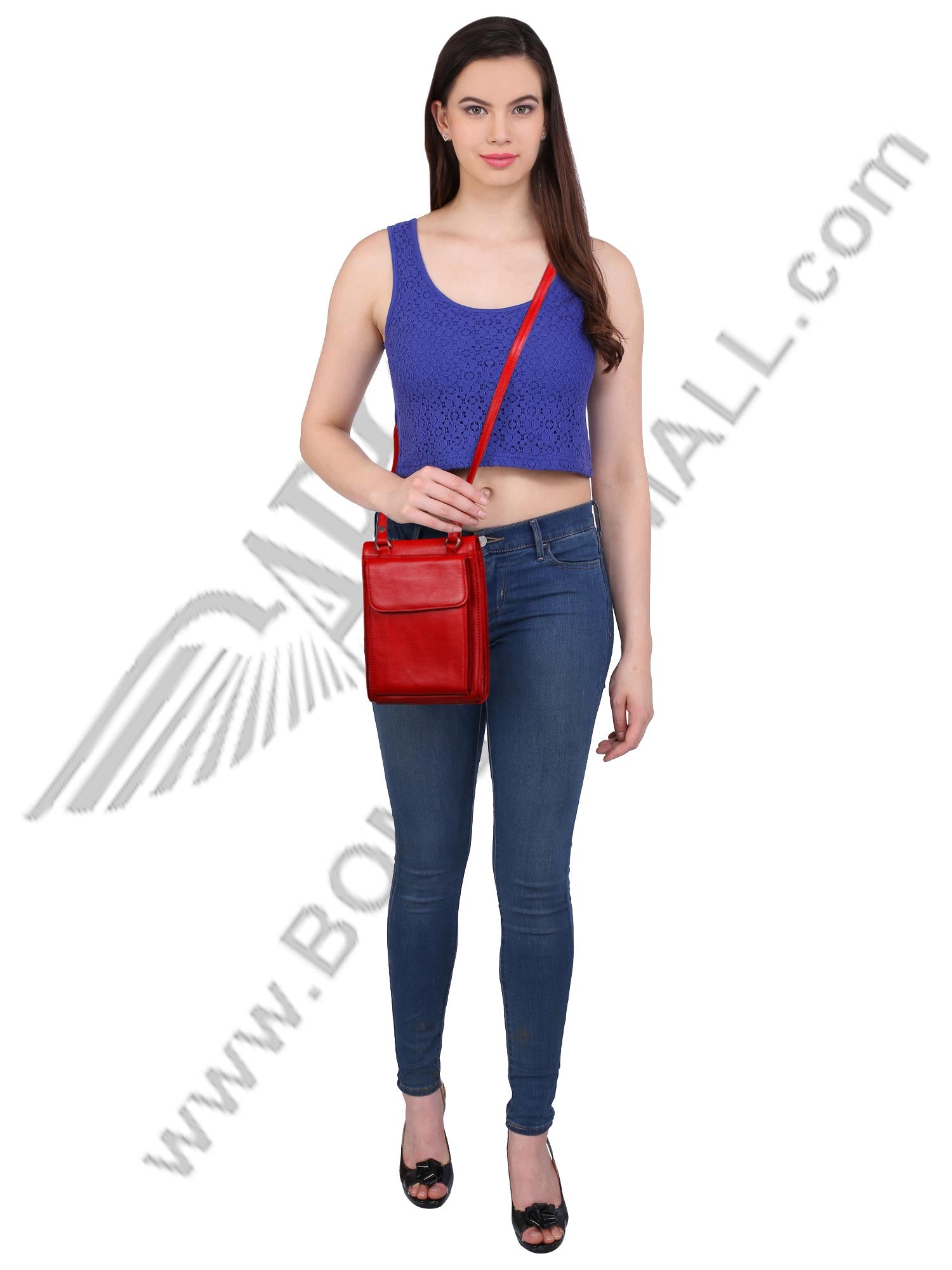 Model posing with red sling bag across the shoulder