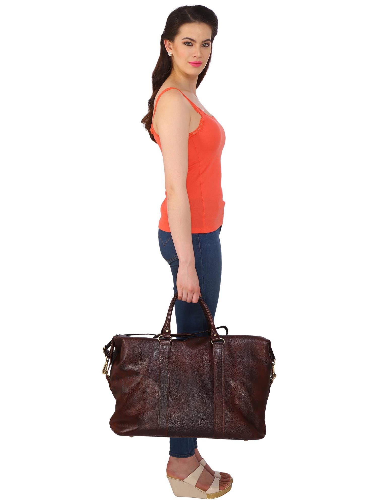 Model giving side pose with brown CARRY ON TOTE SAA-SMALL