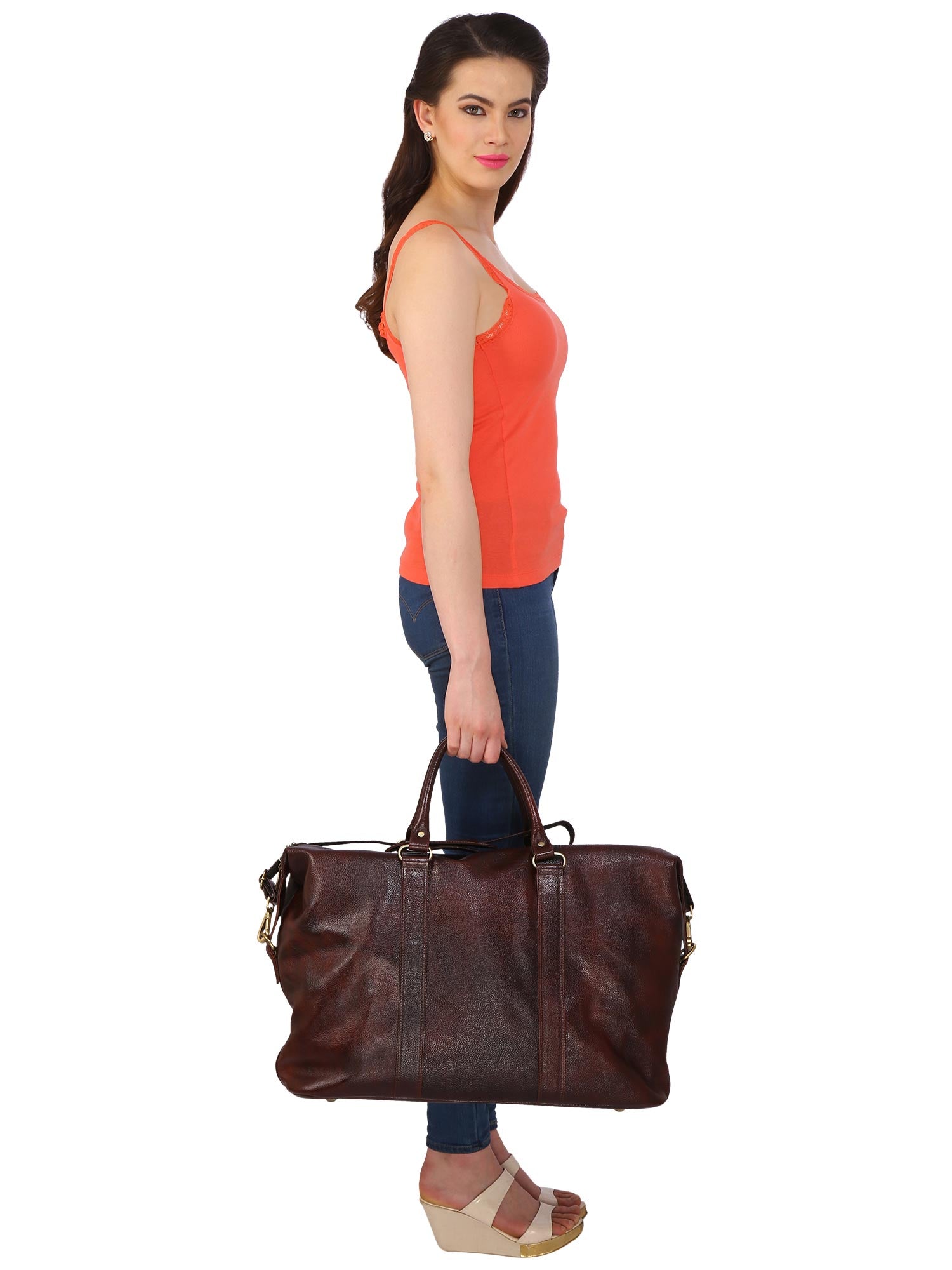 Model posing in side view with CARRY ON TOTE SAA MEDIUM SIZE